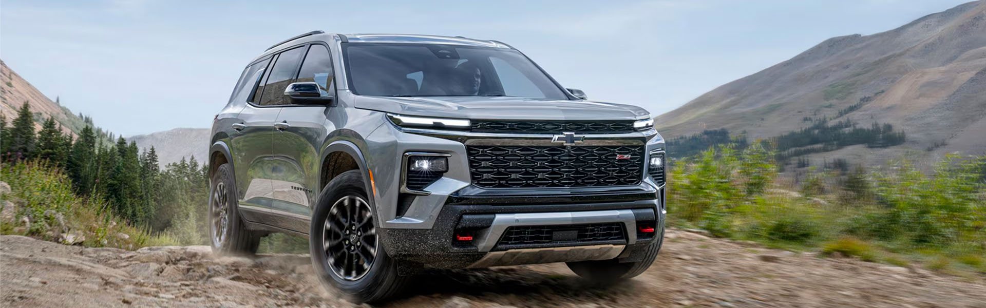 Chevrolet Traverse SUV driving off-road.