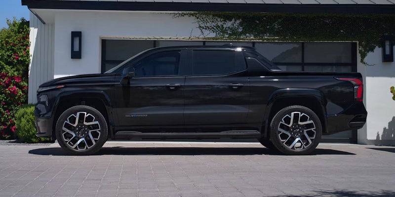 Side view of a black 2025 Chevrolet Silverado EV